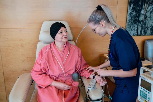 Cancer patient and nurse.